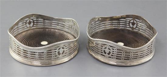 A pair of George III pierced and engraved silver wine coasters by Hester Bateman, 12cm.